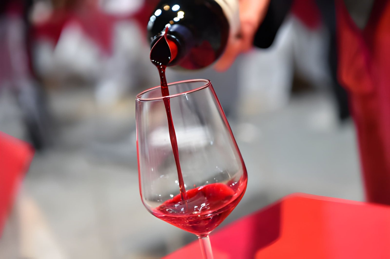 Sommelier Red Wine Pouring into Crystal Tasting Glass